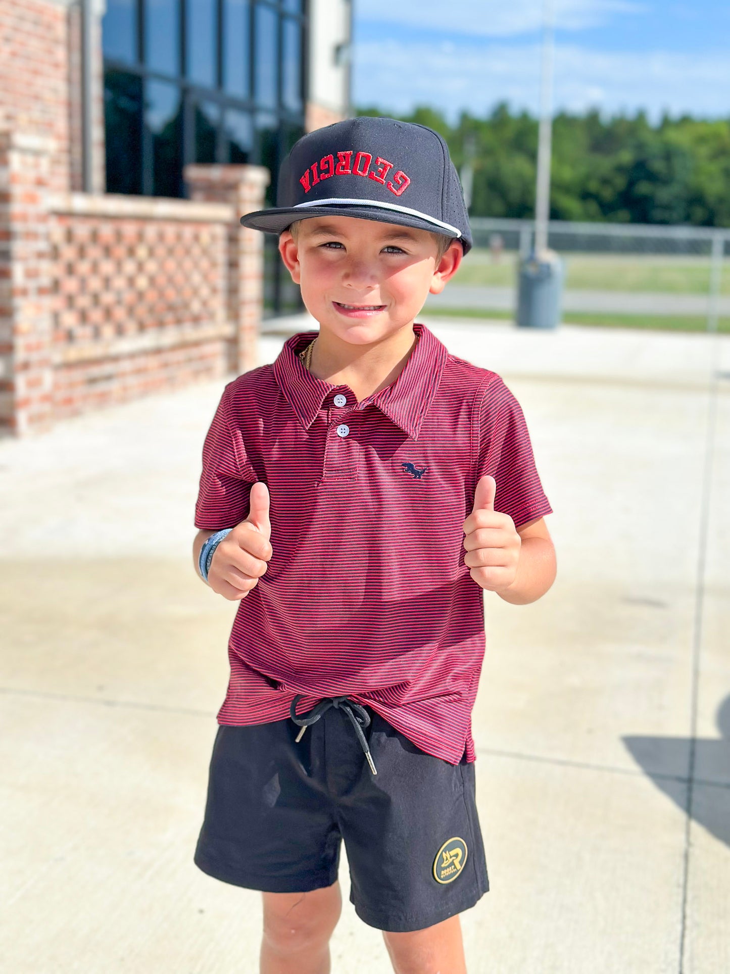 AutiLove Youth Stripe Performance Polo in Red & Black