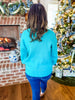 A Cozy Charm Sweater in Turquoise