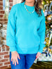 A Cozy Charm Sweater in Turquoise